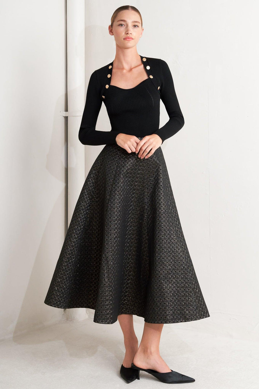 A textured metallic threaded woven circle skirt with back zipper closure.