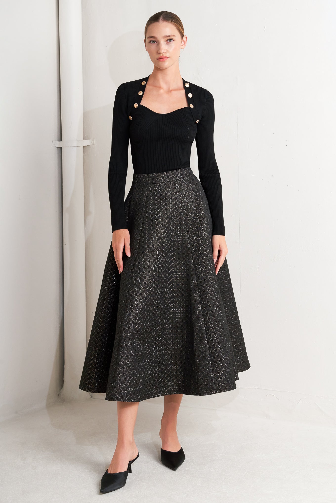 A textured metallic threaded woven circle skirt with back zipper closure.