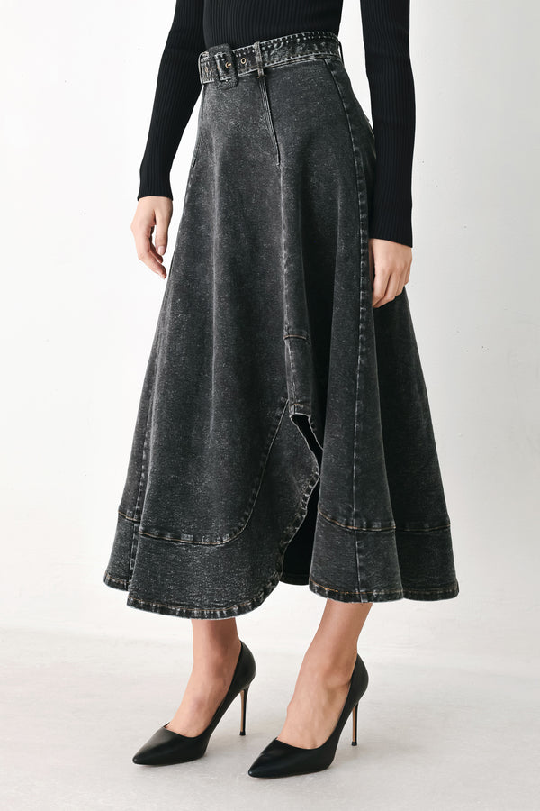 A model wearing a high-waisted, dark gray washed denim midi skirt with a decorative studded belt | FREEMARKET