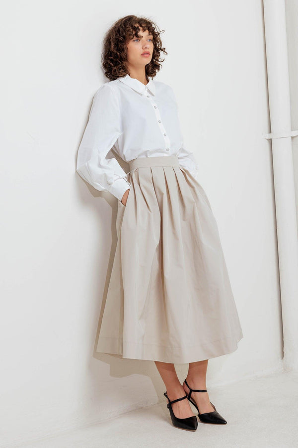 A solid woven full midi skirt with back zipper closure
