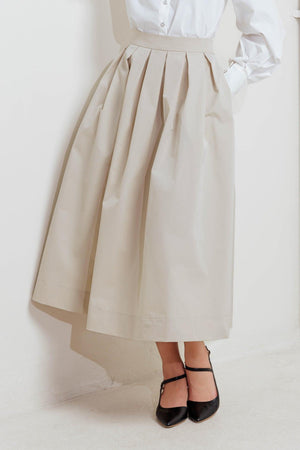 A solid woven full midi skirt with back zipper closure