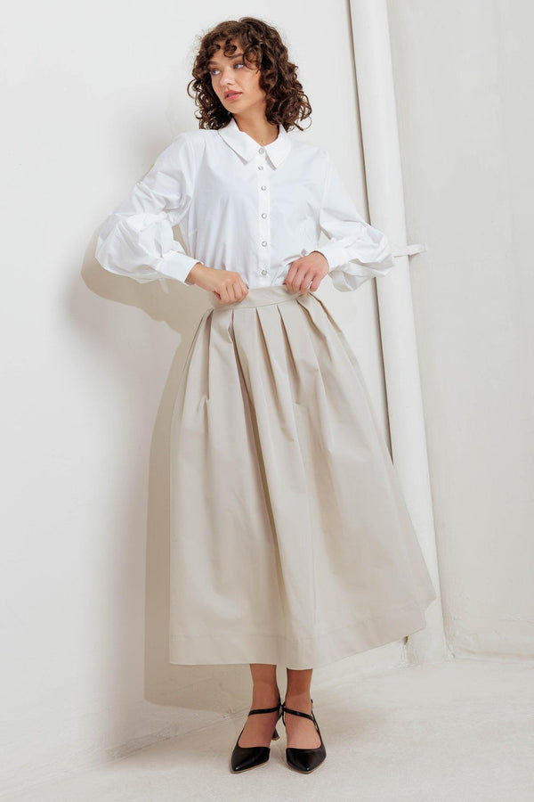 A solid woven full midi skirt with back zipper closure