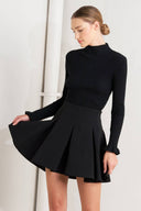 Woman wearing a black skirt | FREEMARKET