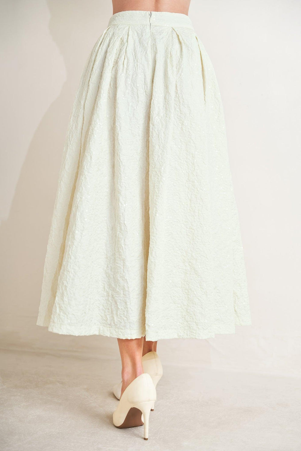 
A textured woven full skirt with back zipper closure. Matching top FT1754S

Details:

Self : 100% Polyester

Size &amp; Fit

- Model is 5`8" And Wearing Size Small
- Measurements Taken From Size Small
- Approx. Length: 36"