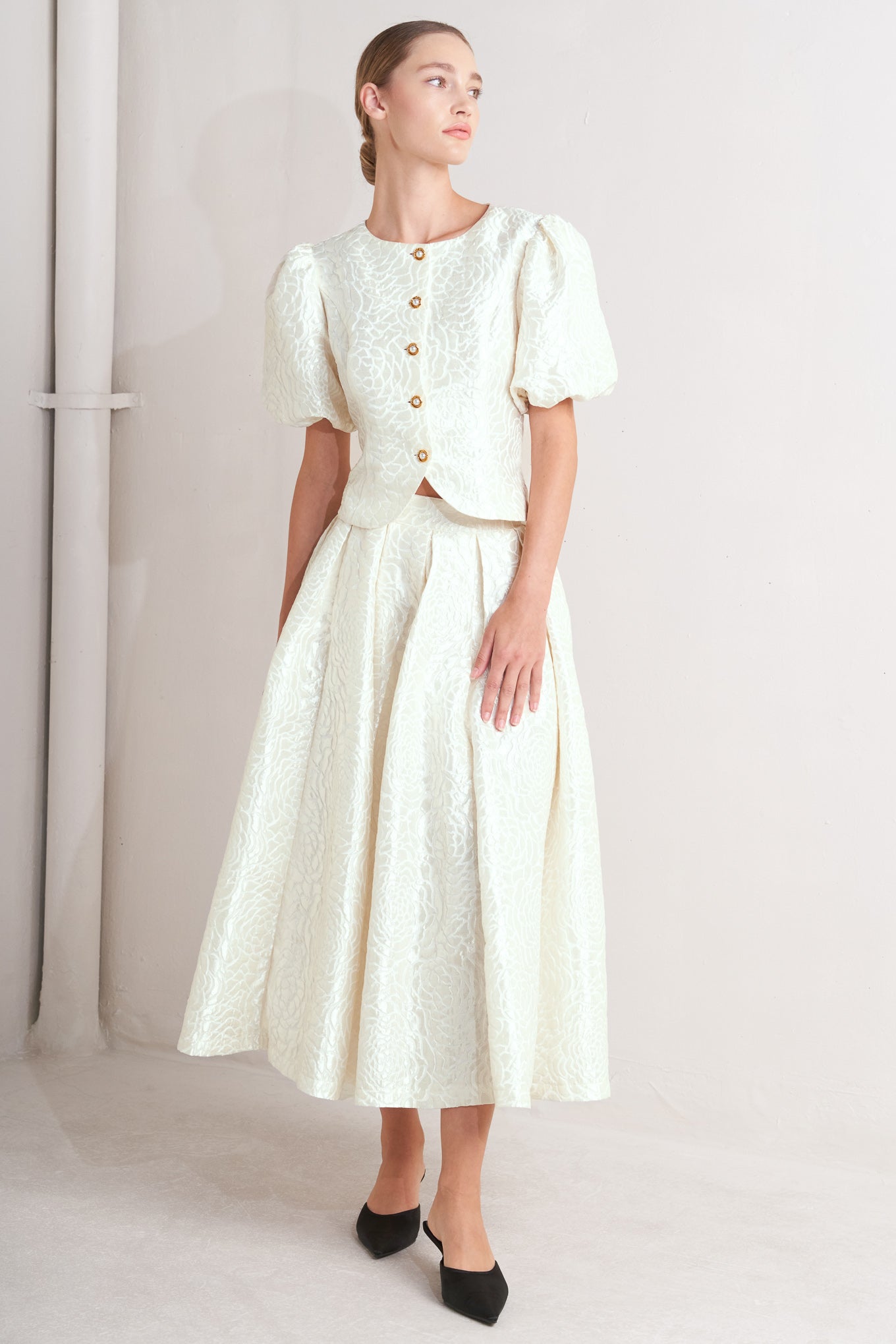A textured woven full midi skirt with back zipper closure.