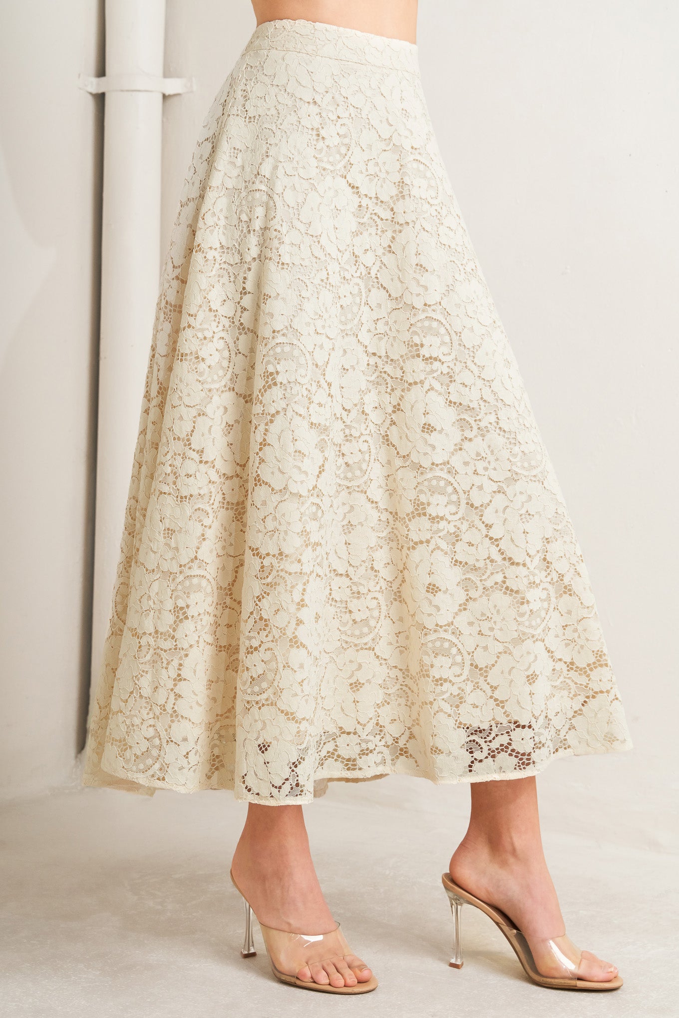A woven lace circle midi skirt with back zipper closure

Details:

Self: 65% Cotton 35% Nylon

Lining: 100% Cotton

Size & Fit

-Model is 5`8" And Wearing Size Small
-Measurements Taken From Size Small
-Approx. Length: 37"