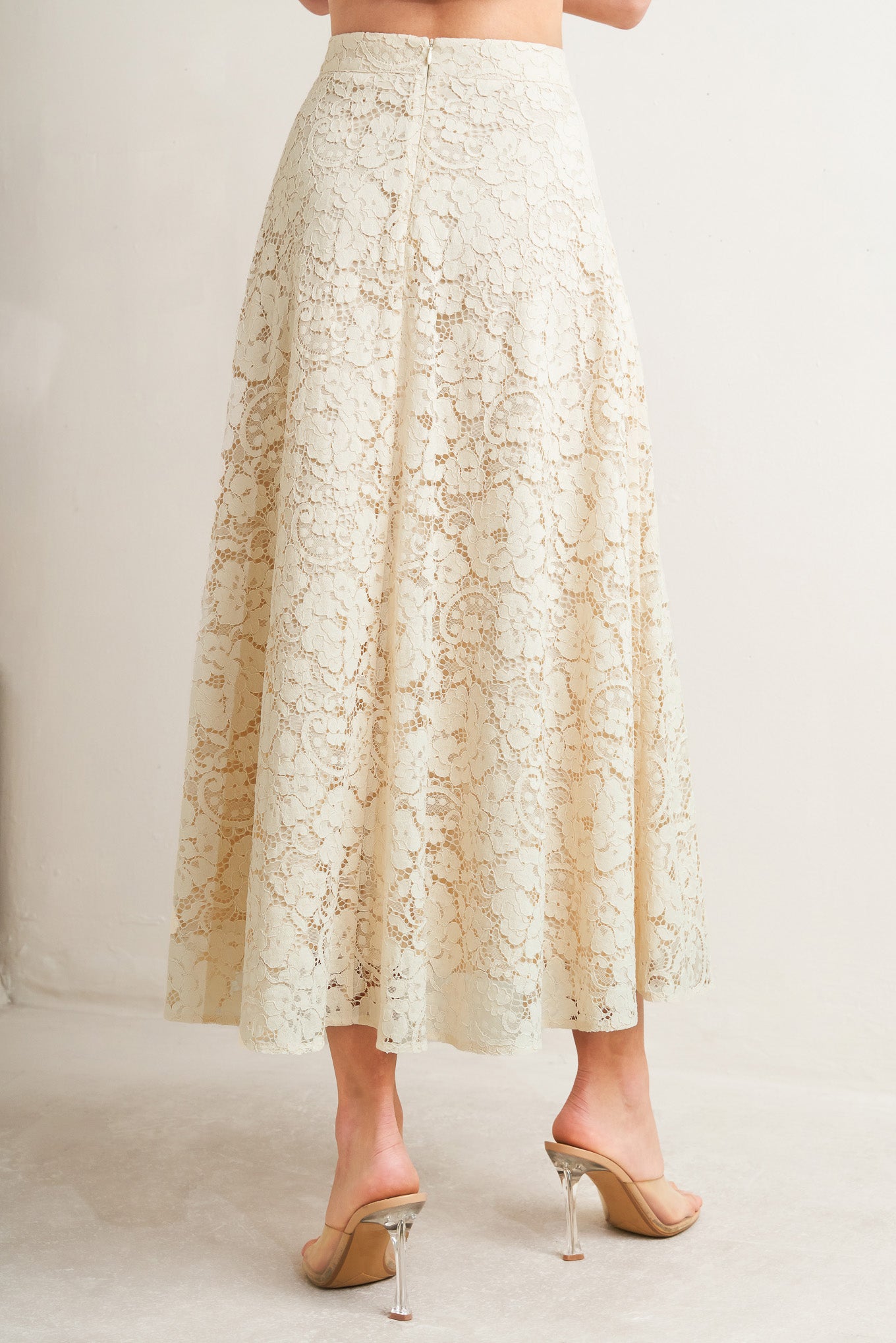 A woven lace circle midi skirt with back zipper closure

Details:

Self: 65% Cotton 35% Nylon

Lining: 100% Cotton

Size & Fit

-Model is 5`8" And Wearing Size Small
-Measurements Taken From Size Small
-Approx. Length: 37"