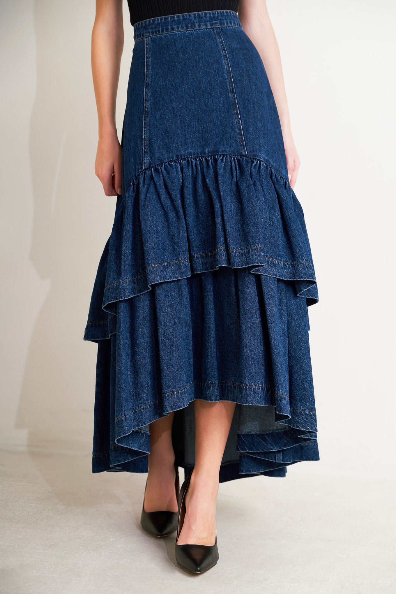 
A washed denim maxi skirt with double layer ruffle bottom and back zipper closure

Details:

Self : 90% Cotton 10% Polyester
Lining : 90% Polyester 10% Cotton

Size &amp; Fit

- Model is 5`8" And Wearing Size Small
- Measurements Taken From Size Small
- Approx. Length: 37"