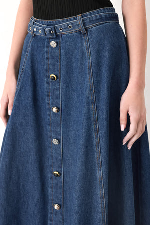 Woman wearing a blue denim circle midi skirt featuring self belt, button down detail and back zipper closure | FREEMARKET
