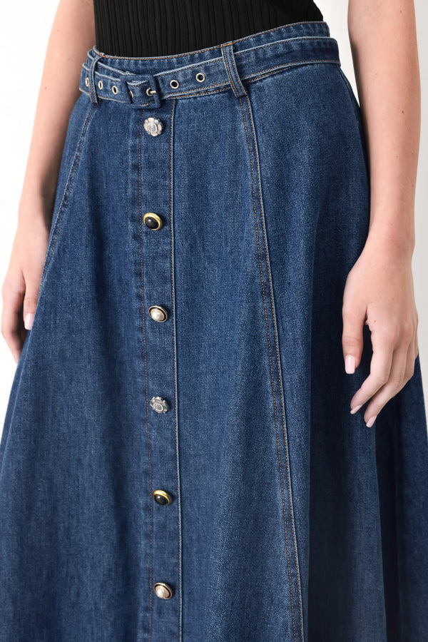 Woman wearing a blue denim circle midi skirt featuring self belt, button down detail and back zipper closure | FREEMARKET