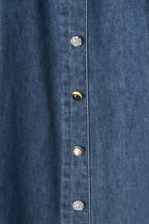 Close up of a blue denim circle midi skirt featuring self belt, button down detail and back zipper closure | FREEMARKET