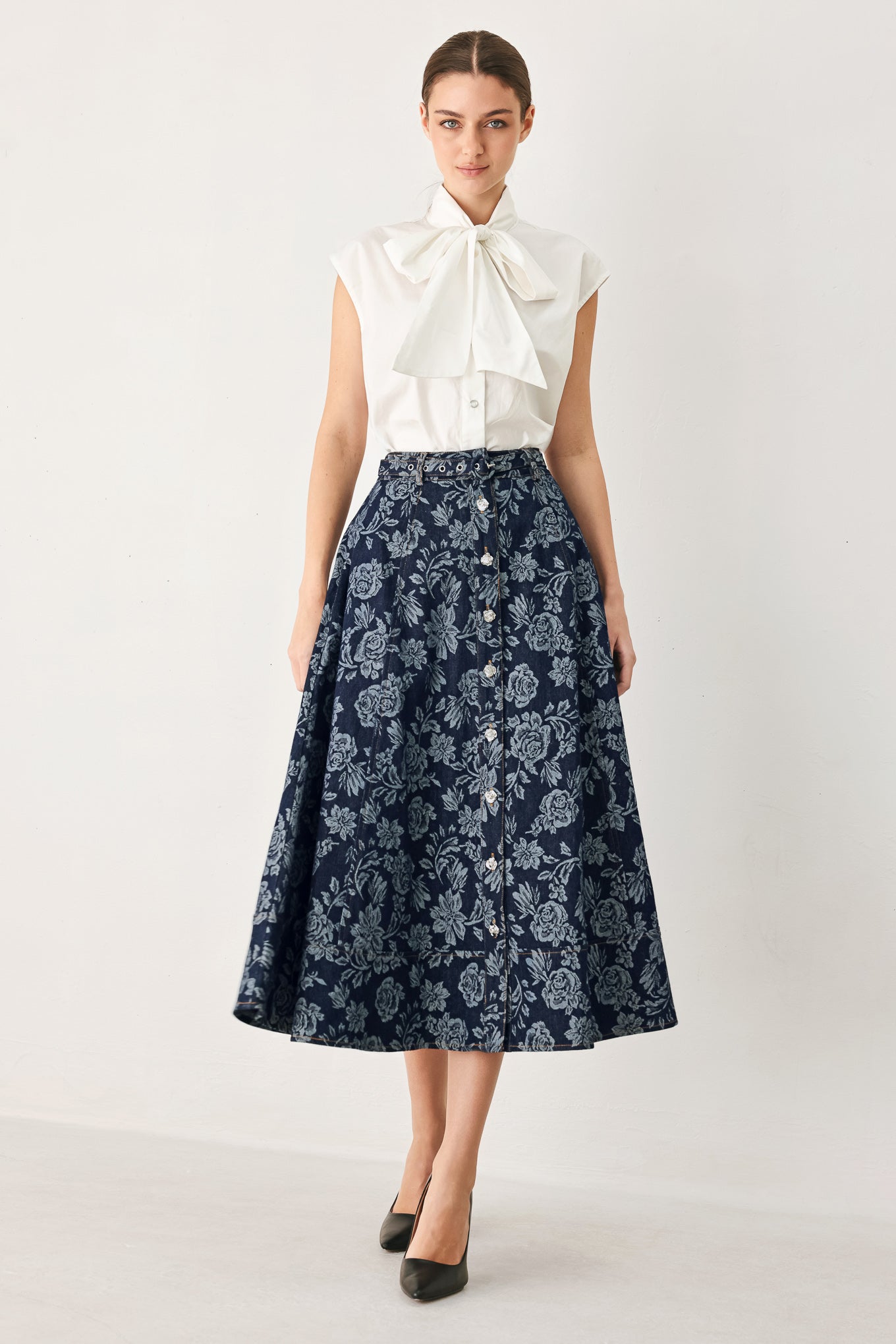 Woman wearing a denim woven jacquard full skirt with self belt and front button down | FREEMARKET