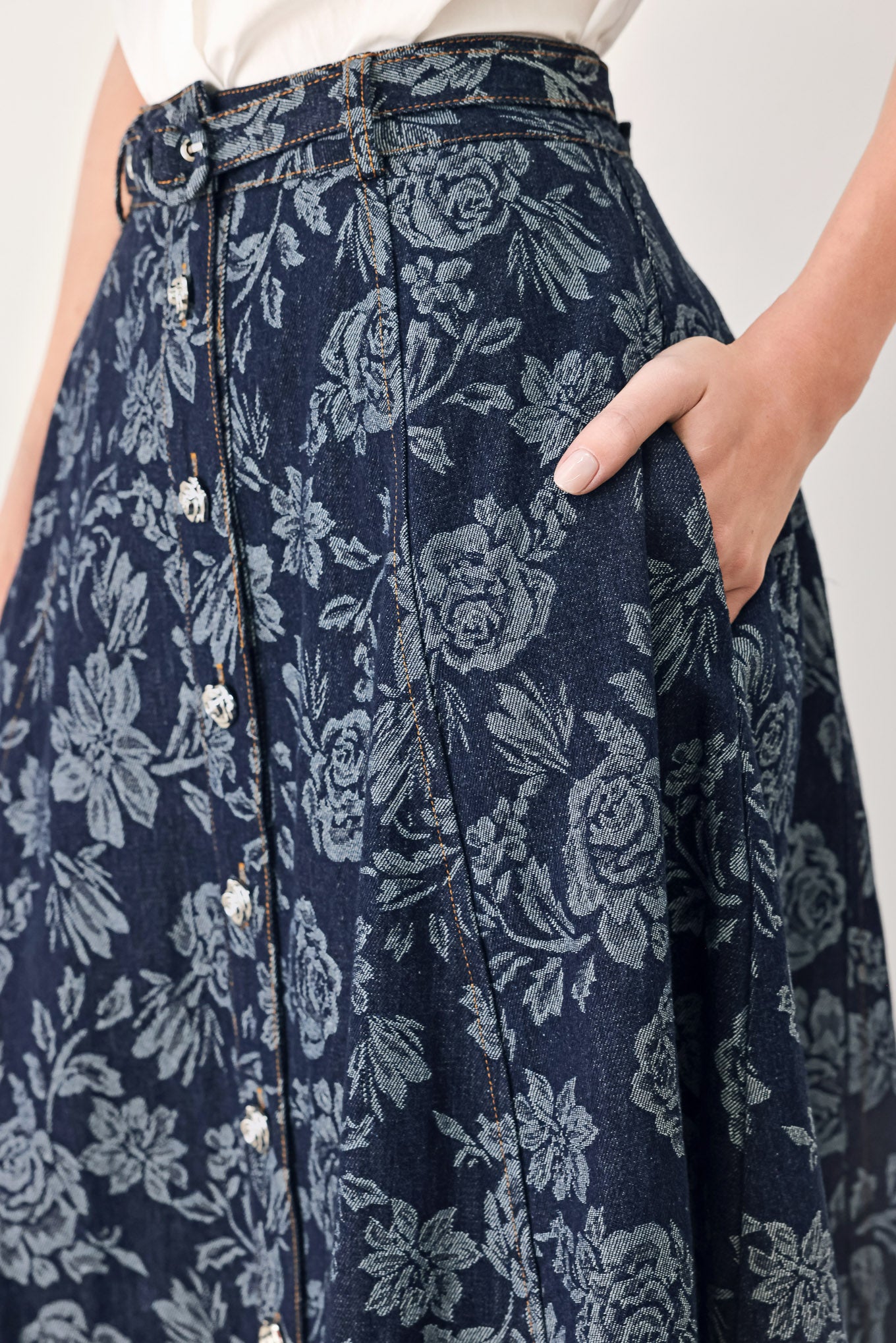 Woman wearing a denim woven jacquard full skirt with self belt and front button down | FREEMARKET