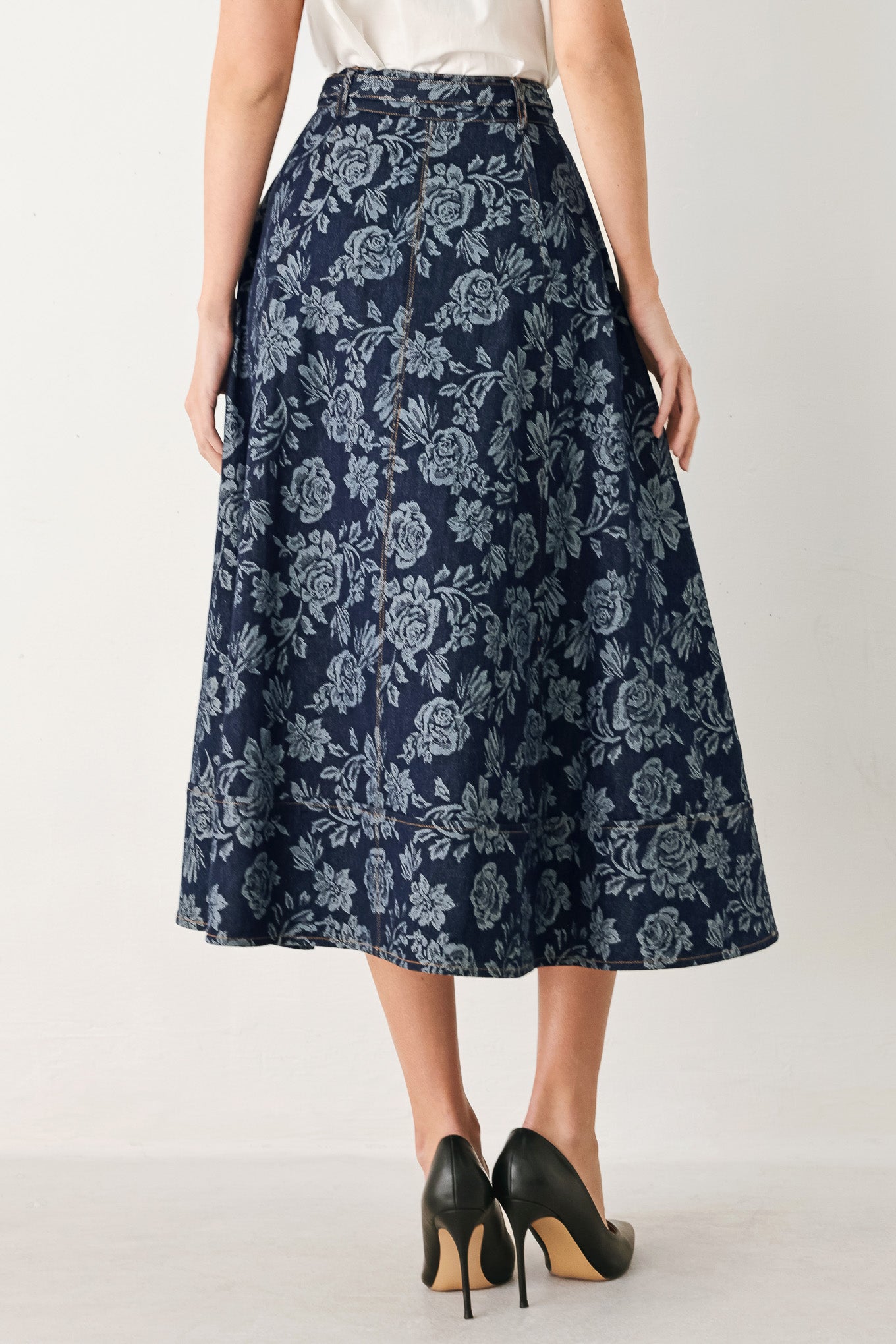 Woman wearing a denim woven jacquard full skirt with self belt and front button down | FREEMARKET