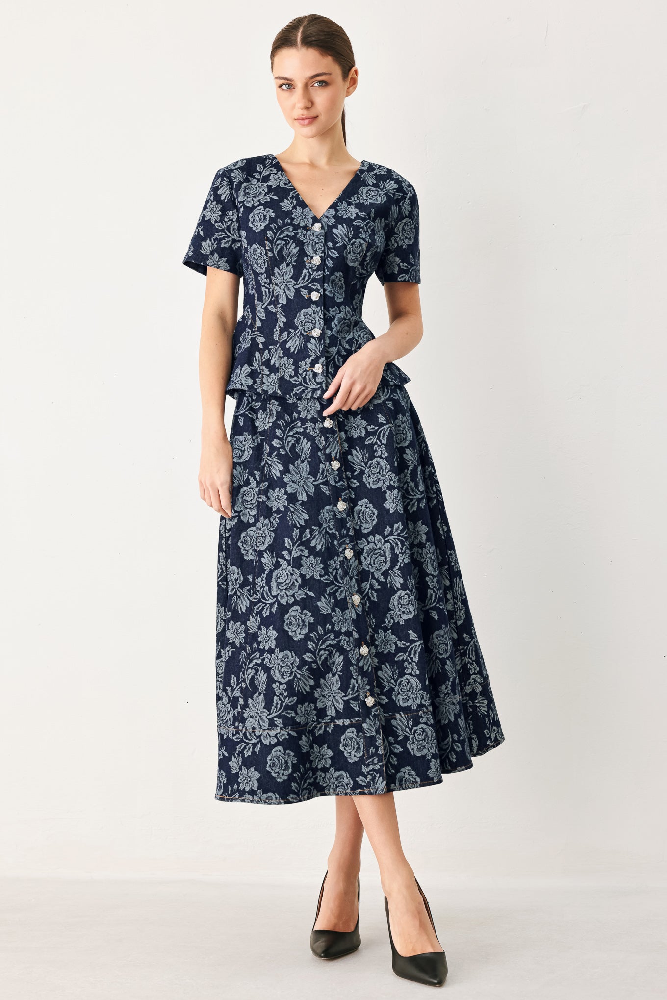 Woman wearing a denim woven jacquard full skirt with self belt and front button down | FREEMARKET