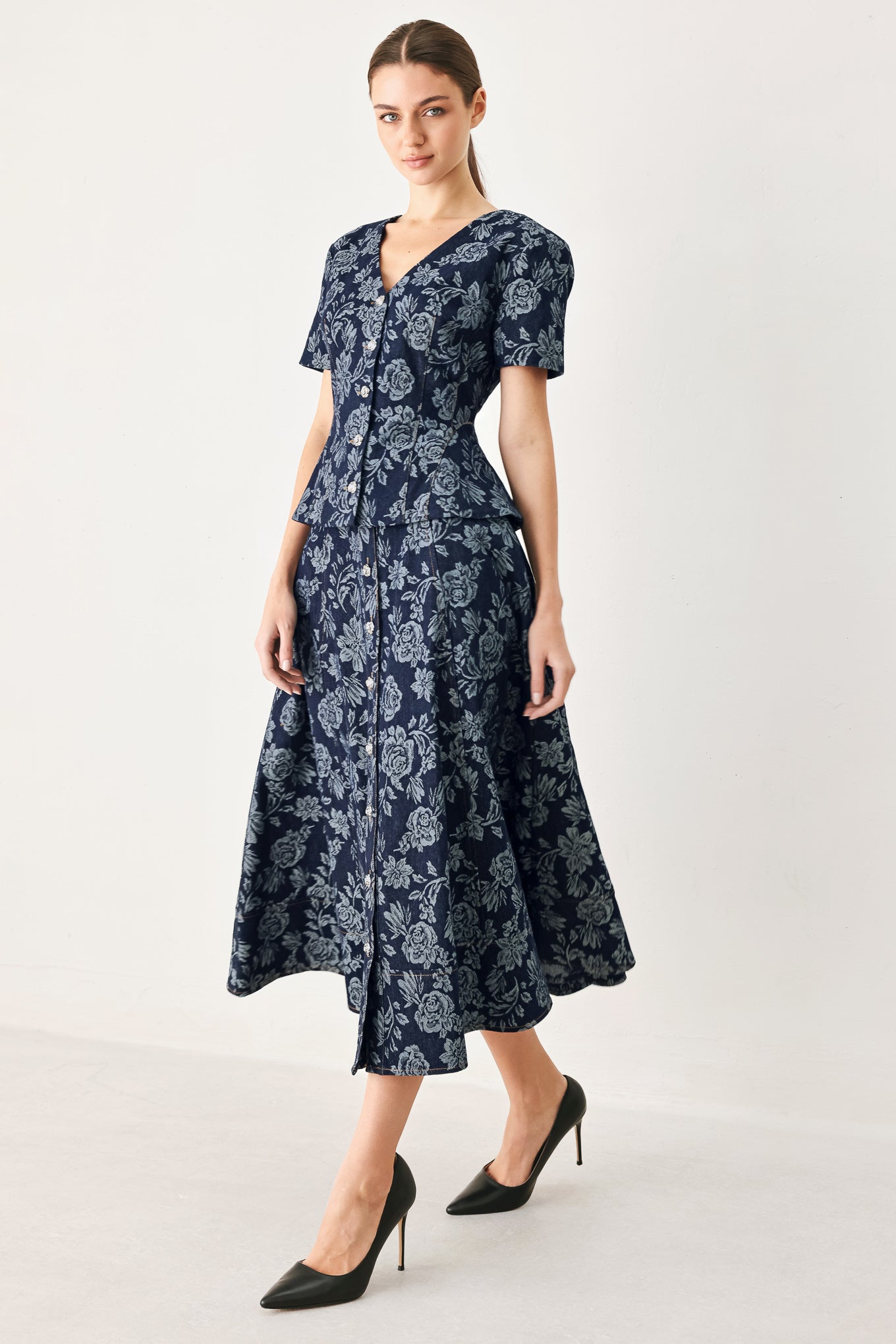 Woman wearing a denim woven jacquard full skirt with self belt and front button down | FREEMARKET