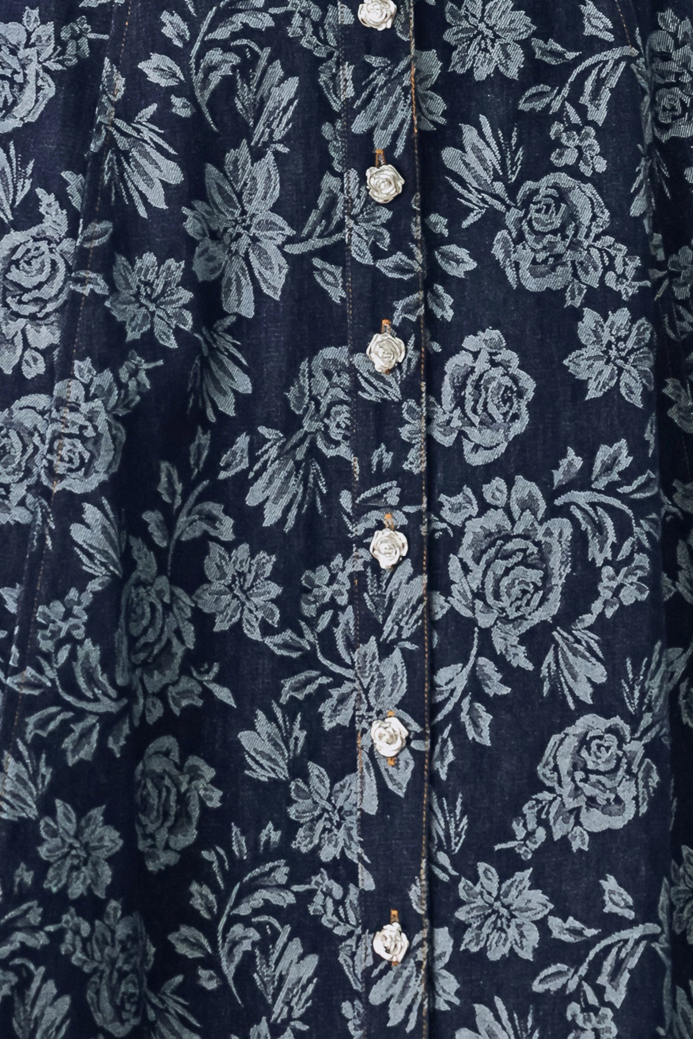 Woman wearing a denim woven jacquard full skirt with self belt and front button down | FREEMARKET