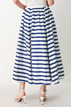 Woman wearing a blue and white striped printed woven full skirt with elastic waist and tie | FREEMARKET
