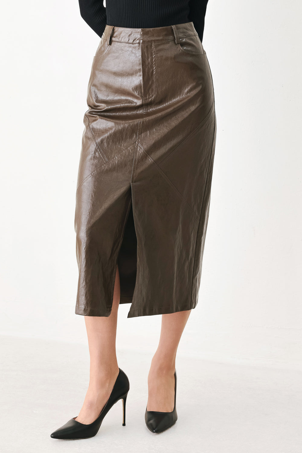 A model wearing a brown faux-leather midi skirt | FREEMARKET