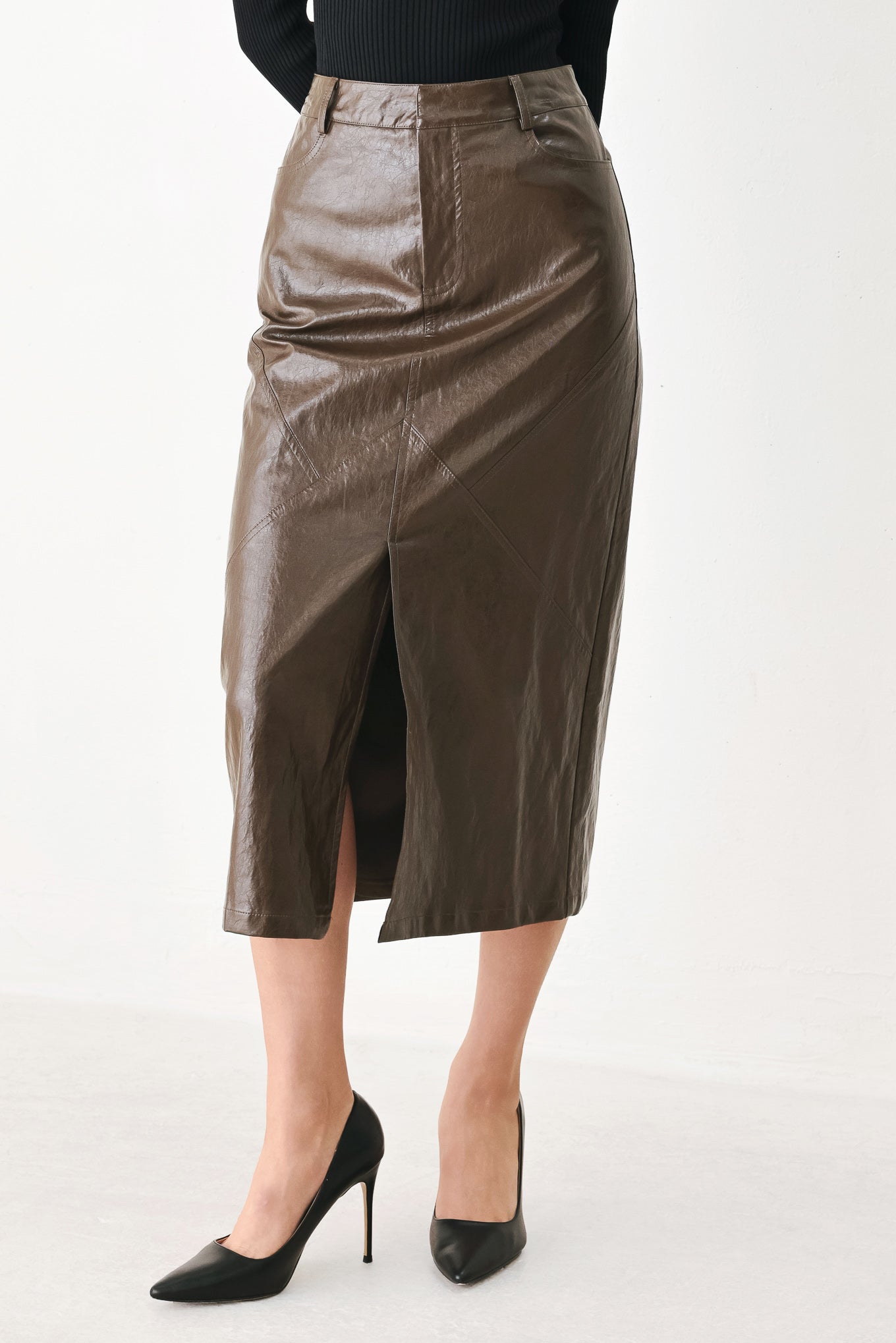 A model wearing a brown faux-leather midi skirt | FREEMARKET