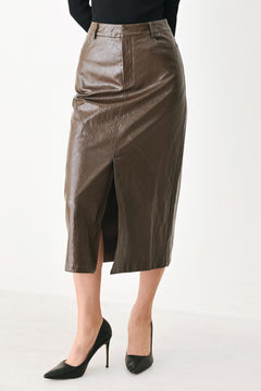 A model wearing a brown faux-leather midi skirt | FREEMARKET