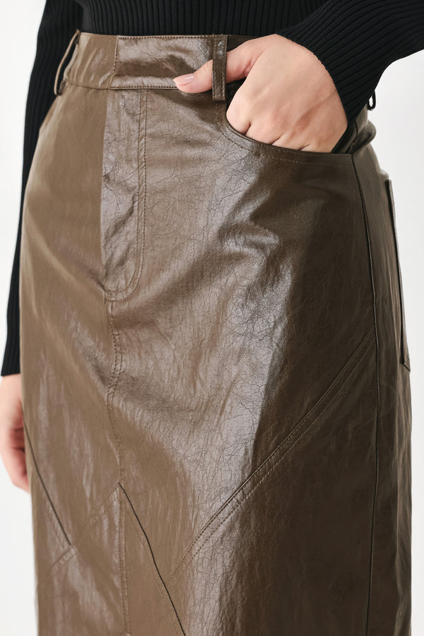 A model wearing a brown faux-leather midi skirt | FREEMARKET