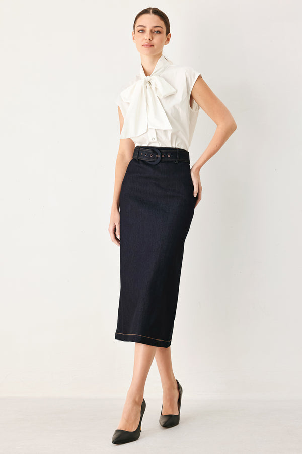 Woman wearing a dark blue denim mini pencil skirt with self belt, back slit and zipper closure | FREEMARKET