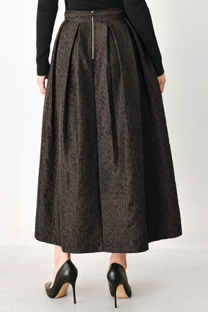 A high-waisted, pleated midi skirt in a dark brown and black jacquard leopard print pattern, styled with a matching belt  | FREEMARKET