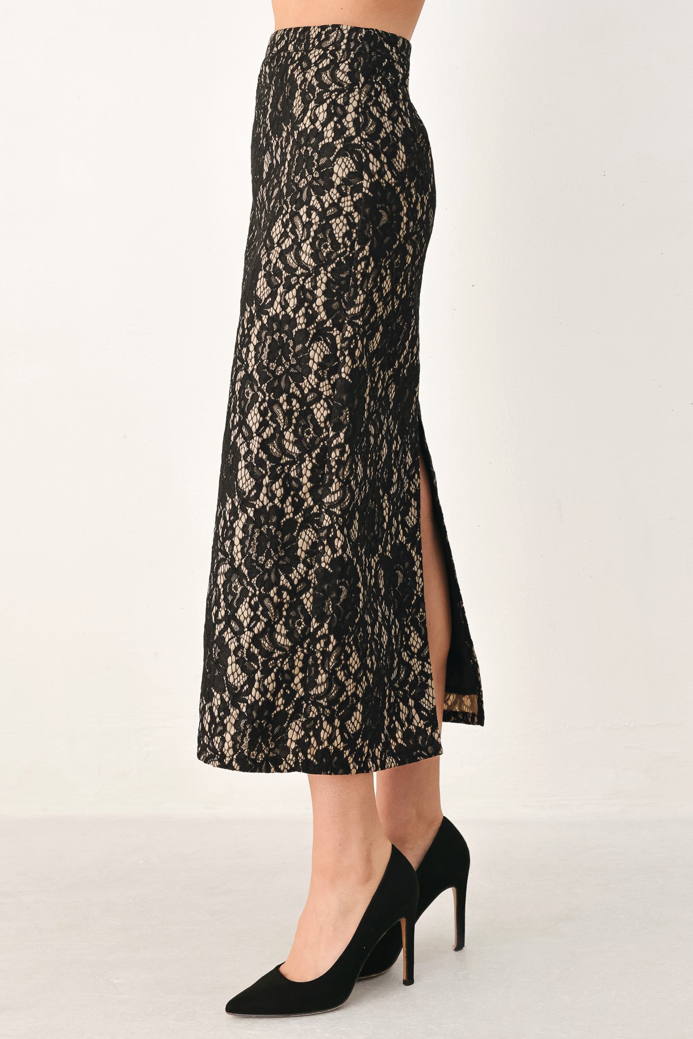 A model wearing a black lace midi skirt | Flying Tomato