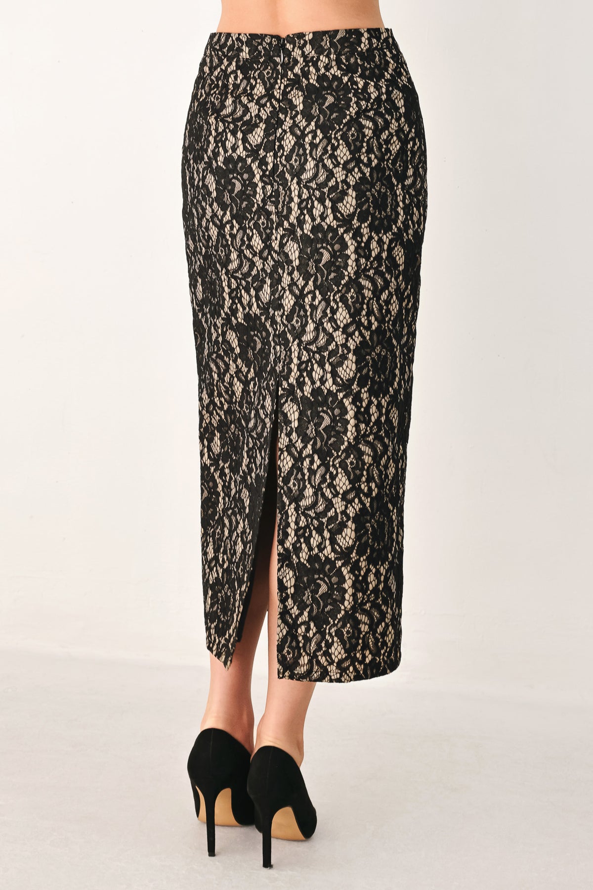 A model wearing a black lace midi skirt | Flying Tomato