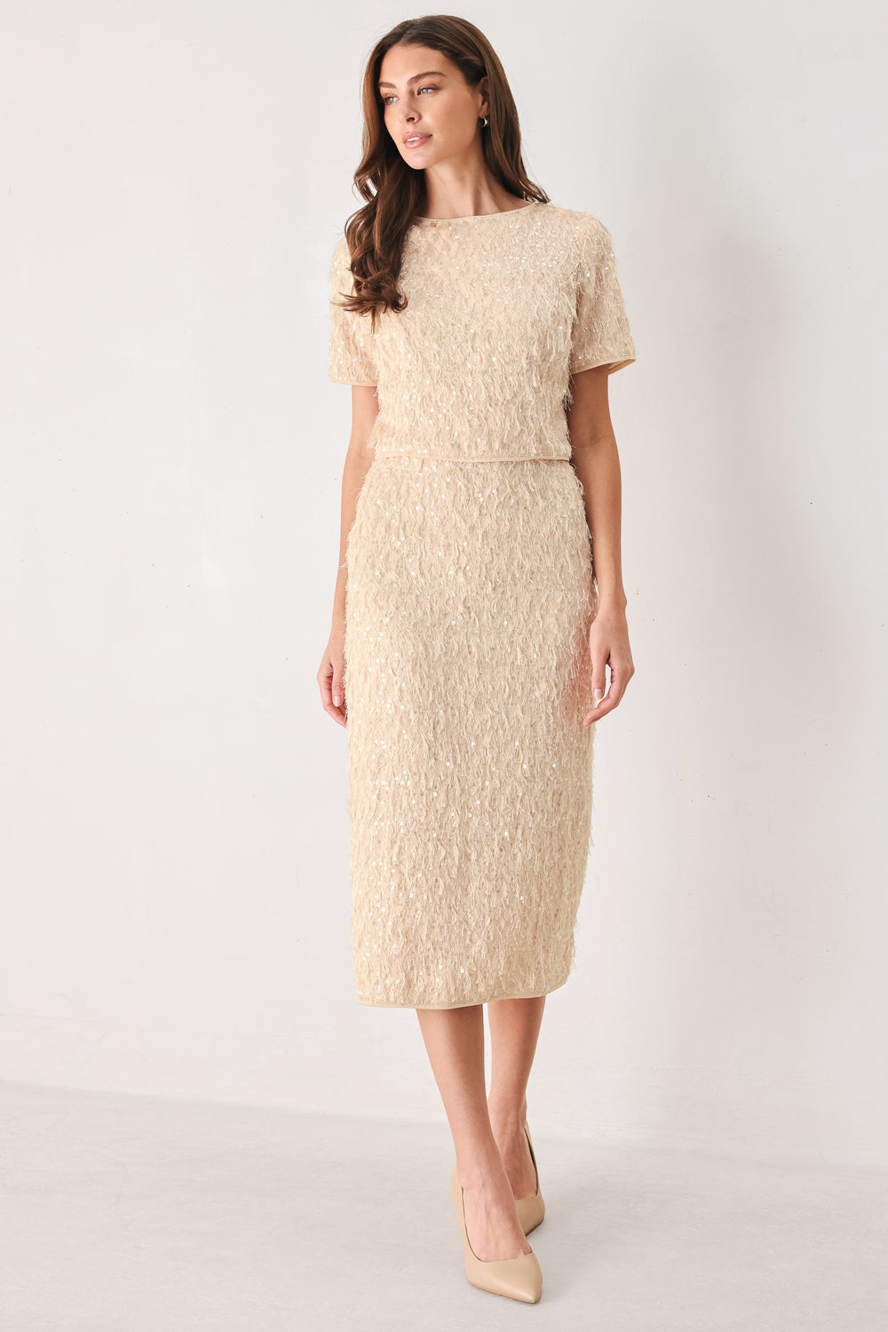 Woman wearing a high waisted midi skirt with sequins and fine faux fur/feathers | FREEMARKET