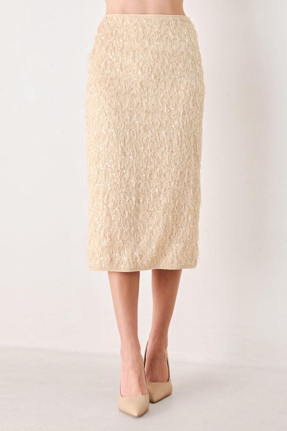 Woman wearing a high waisted midi skirt with sequins and fine faux fur/feathers | FREEMARKET