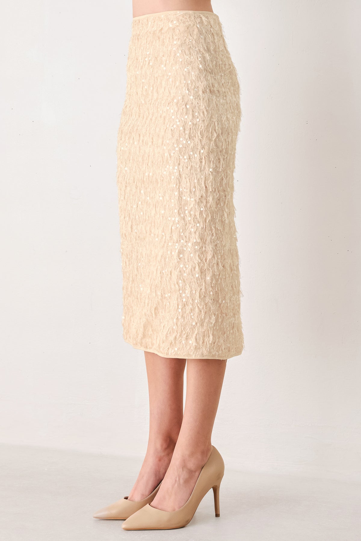 Woman wearing a high waisted midi skirt with sequins and fine faux fur/feathers | FREEMARKET