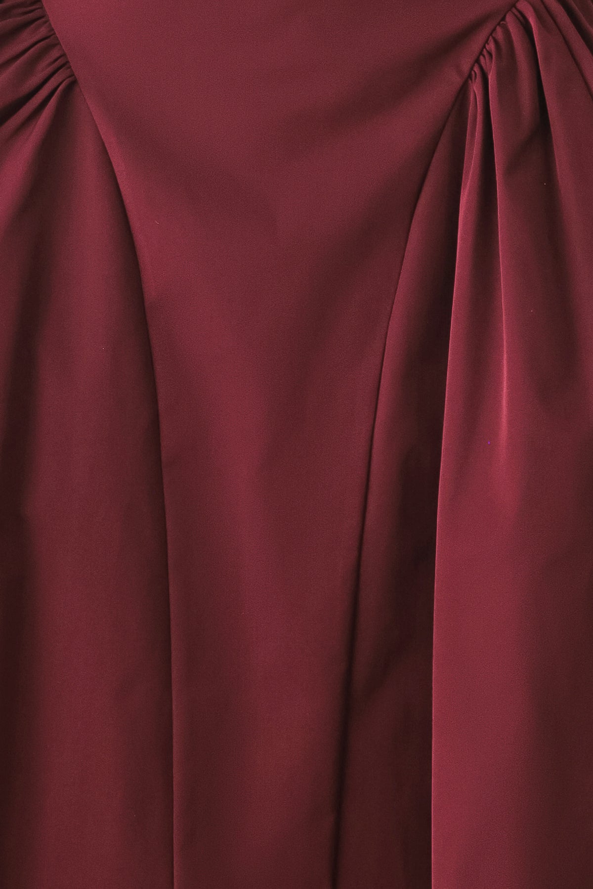 Woman wearing a high waisted burgundy midi skirt with side shirring along the hips | FREEMARKET