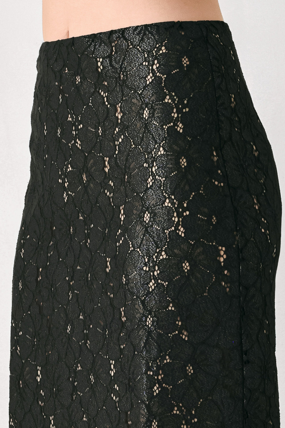 Woman wearing a black lace high waisted midi skirt with a nude base | FREEMARKET