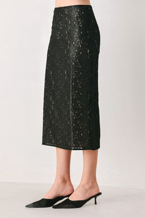 Woman wearing a black lace high waisted midi skirt with a nude base | FREEMARKET