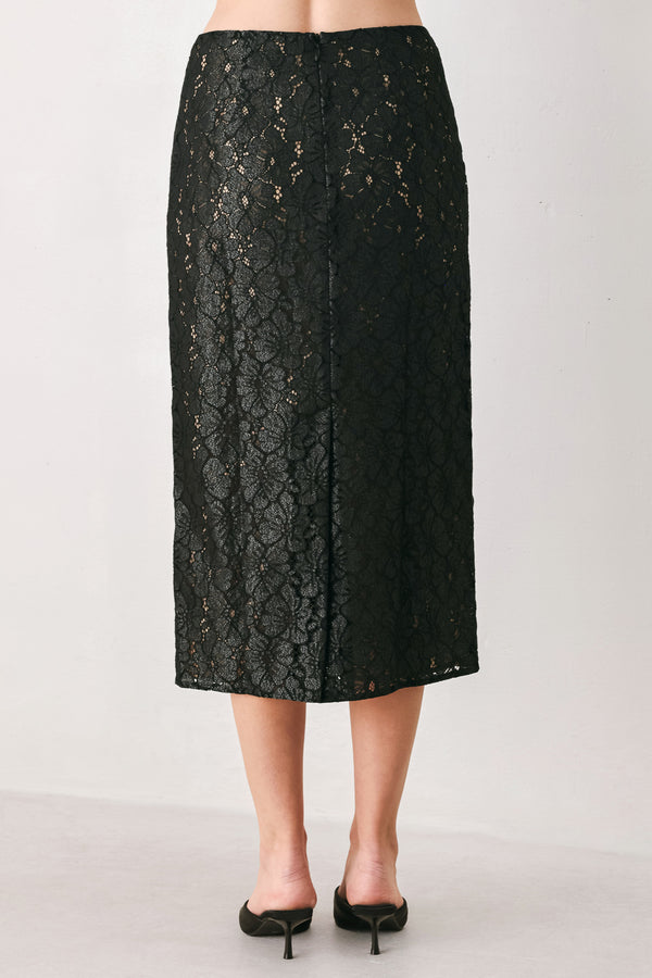 Woman wearing a black lace high waisted midi skirt with a nude base | FREEMARKET