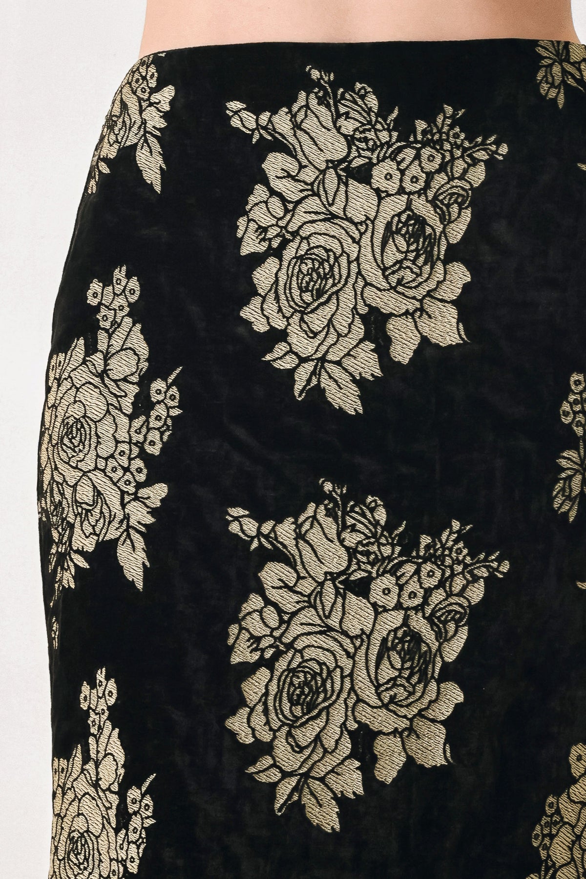 Woman wearing a back high waisted midi skirt with gold jacquard flowers | FREEMARKET