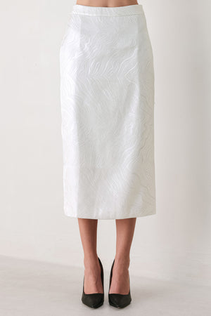 A white midi skirt with a subtle textured, wavy jacquard pattern, shown on a model | FREEMARKET