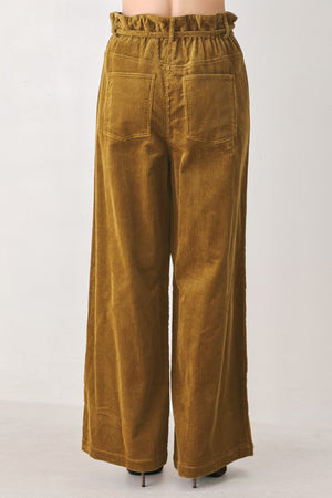 A woman modeling a high-waisted, wide-leg brown corduroy pants with a drawstring waist | FREEMARKET