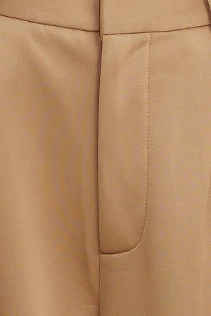 A solid woven pant with front closure and side pockets