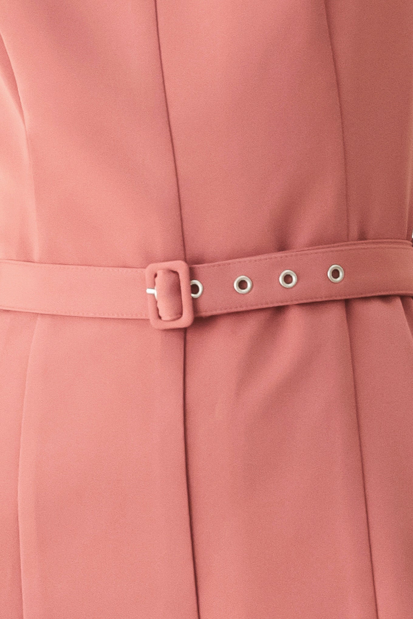 Woman wearing a sleeveless pink rose jumpsuit featuring wide neckline, self belt, wide leg and back zipper closure | FREEMARKET