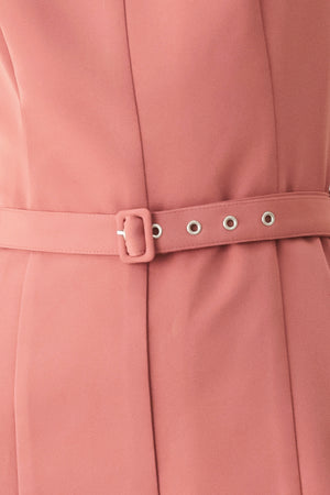 Woman wearing a sleeveless pink rose jumpsuit featuring wide neckline, self belt, wide leg and back zipper closure | FREEMARKET