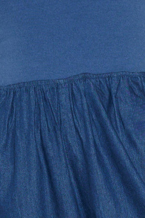 A chambray pant/jumpsuit 2fer with ribbed band and side pocket.