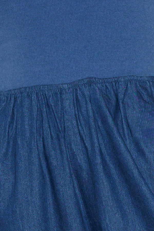 A chambray pant/jumpsuit 2fer with ribbed band and side pocket.