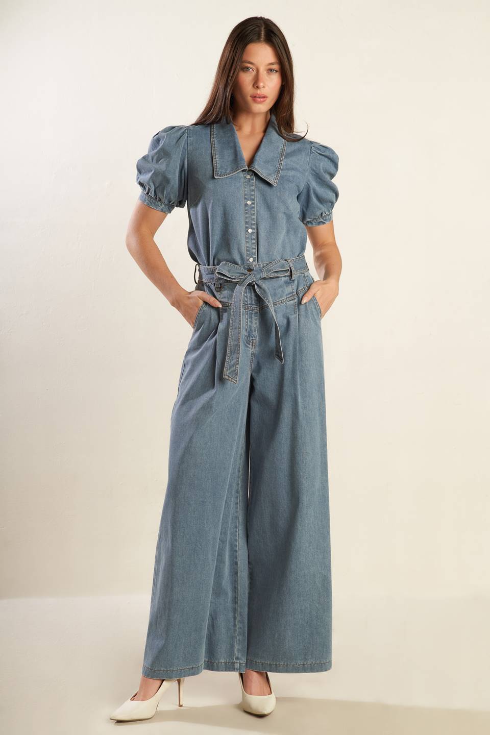 A washed light denim pant featuring front closure with self belt, side pockets, wide leg and elasticized back waistband.