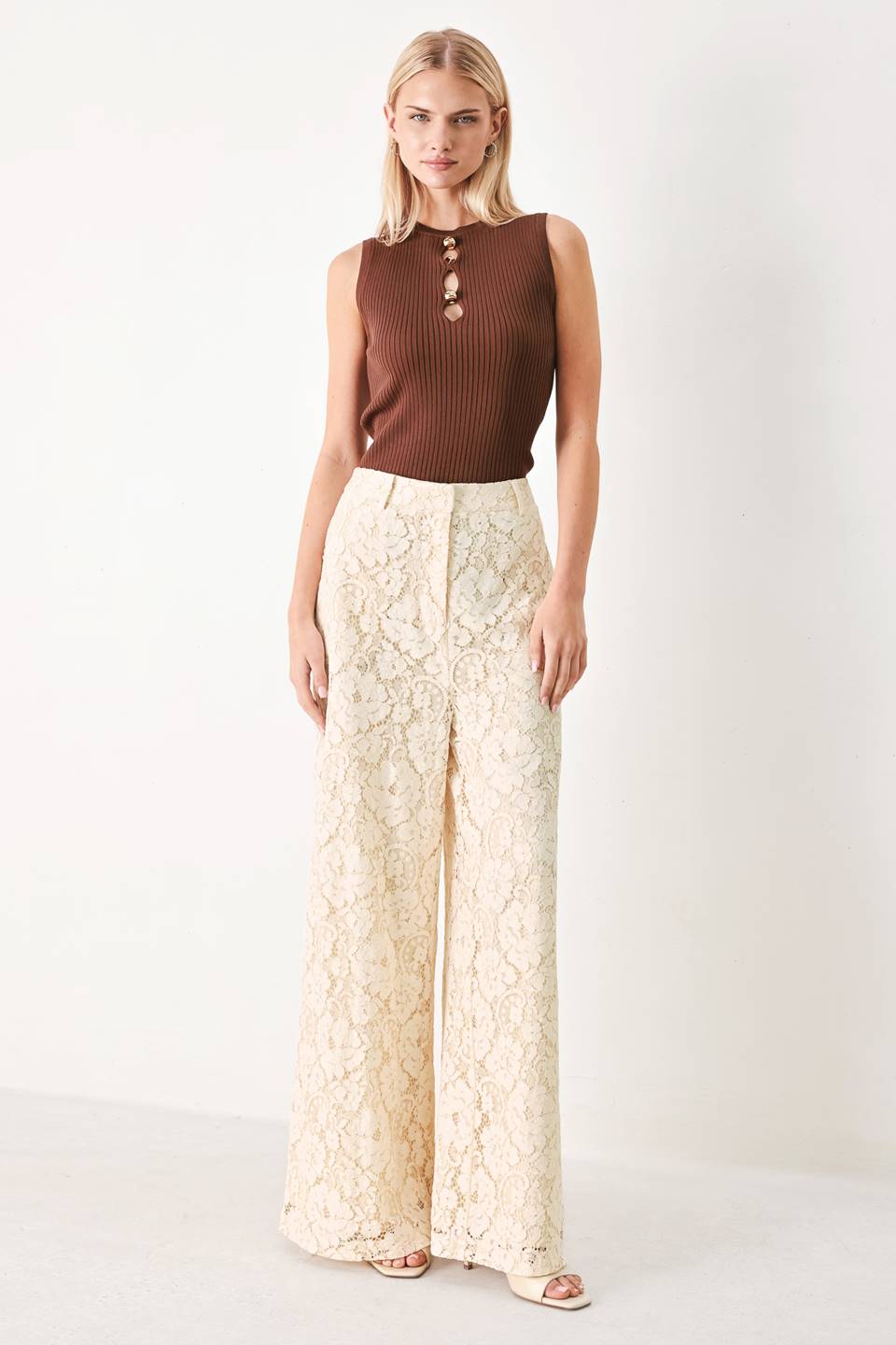 Woman wearing white lace pants with front closure and wide leg | FREEMARKET