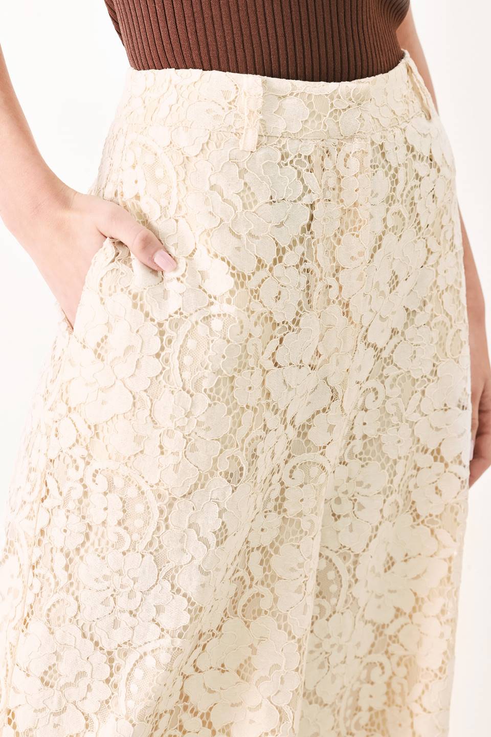 Woman wearing white lace pants with front closure and wide leg | FREEMARKET