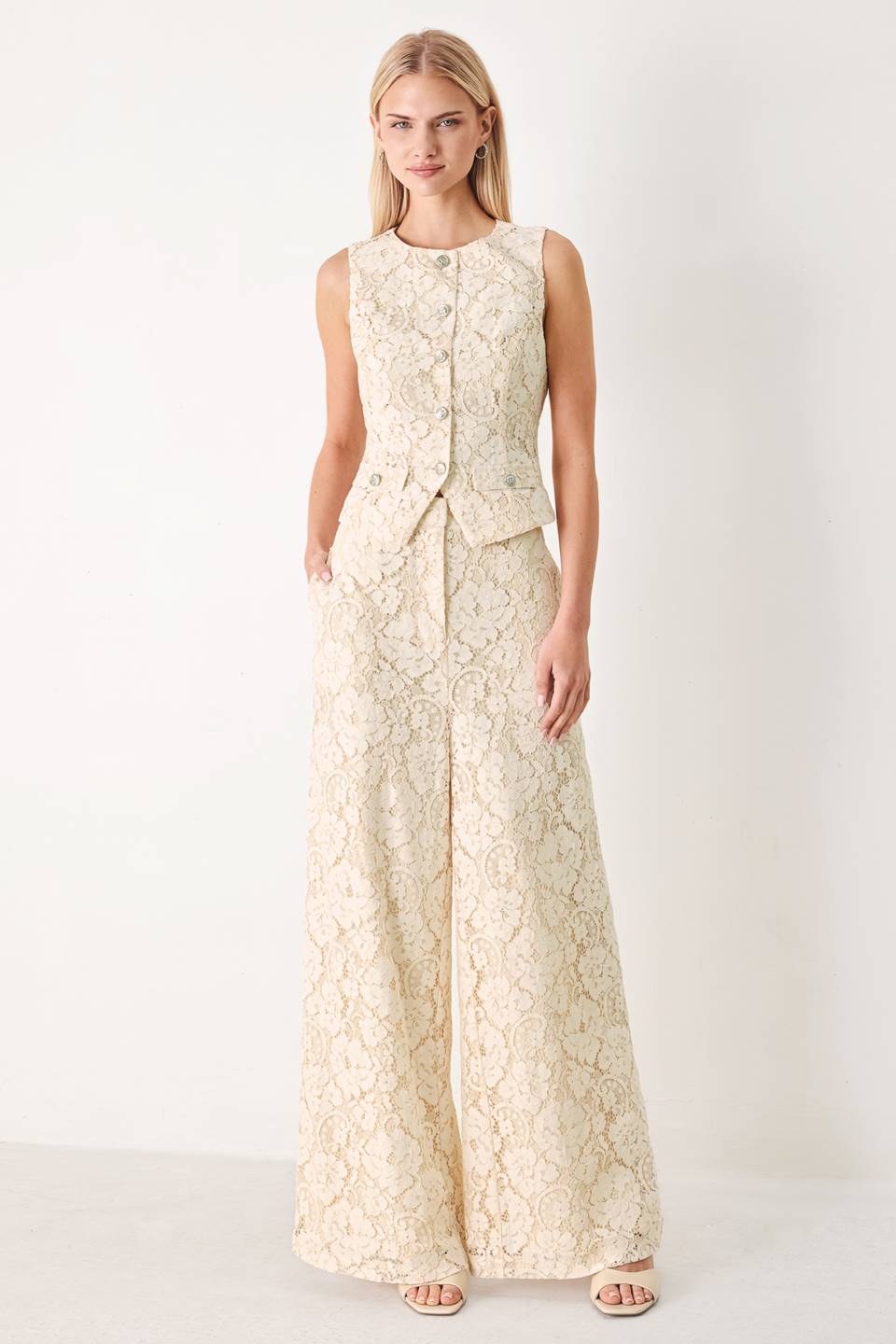 Woman wearing white lace pants with front closure and wide leg | FREEMARKET