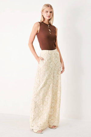 Woman wearing white lace pants with front closure and wide leg | FREEMARKET